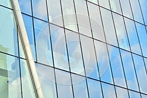 Urban abstract background, detail of modern glass facade, office business building.