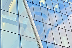 Urban abstract background, detail of modern glass facade, office business building.