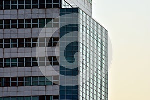 Urban abstract background, detail of modern glass facade, office business building.