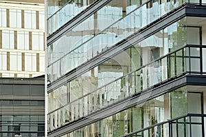 Urban abstract background, detail of modern glass facade, office business building.