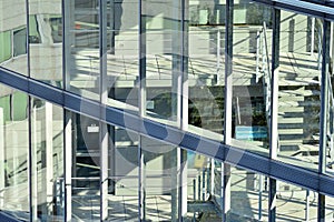 Urban abstract background, detail of modern glass facade, office business building.