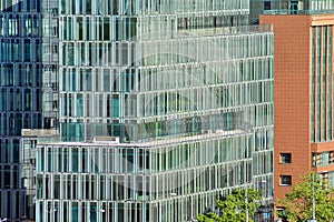 Urban abstract background, detail of modern glass facade, office business building.