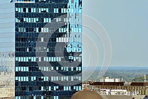 Urban abstract background, detail of modern glass facade, office business building.