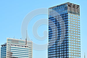 Urban abstract background, detail of modern glass facade, office business building.