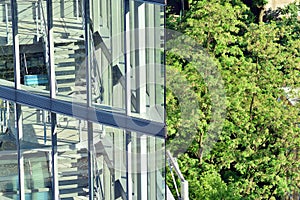 Urban abstract background, detail of modern glass facade, office business building.