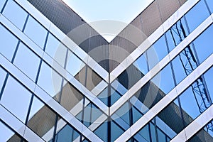 Urban abstract background, detail of modern glass facade, office business building.