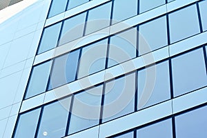 Urban abstract background, detail of modern glass facade, office business building.