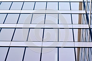 Urban abstract background, detail of modern glass facade, office business building.