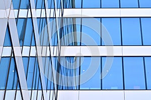 Urban abstract background, detail of modern glass facade, office business building.