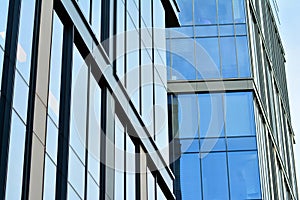 Urban abstract background, detail of modern glass facade, office business building.