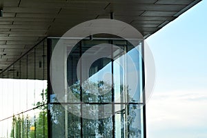 Urban abstract background, detail of modern glass facade, office business building.