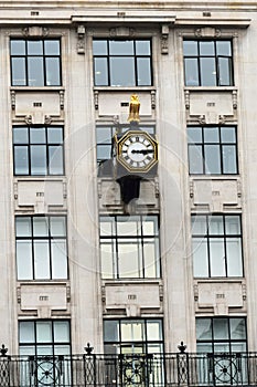 Urban antique clock on building