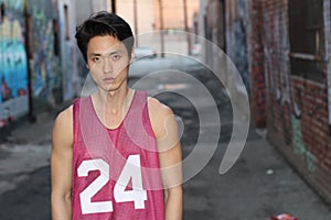 Urban Asian man posing wearing tank top