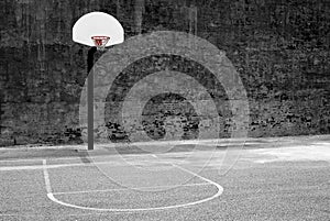 Urban basketball hoop inner city innercity wall and asphalt in o