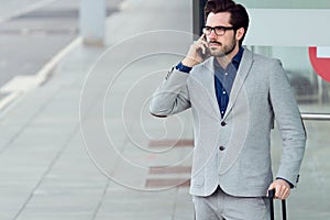 Urban business man talking on smartphone