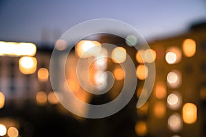 Urban city life: blurry/defocused flats and apartments at dusk. Real estate and property