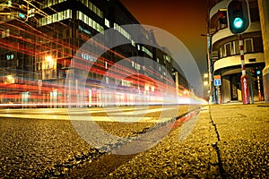 Urban city road with car light trails photo