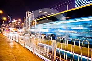 Urban city road with car light trails.