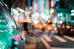 Urban city scene car in traffic with rear view mirror and lights