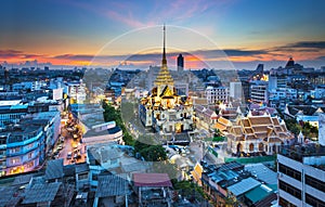Urban City Skyline with Wat Traimit (Temple) Bangkok, Thailand. photo