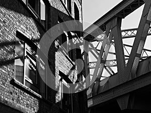 Urban City Street Corner: Vintage Train Bridge and Brick Wall Building in London