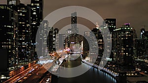 Urban Cityscape of Chicago and Chicago River at Night in Winter. Aerial View. USA