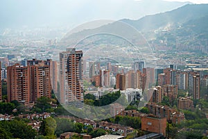 urban cityscape of poblado medellin during a bright and cloudy day photo