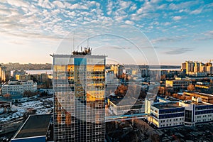 Urban cityscape at sunset, Voronezh city, panorama with city line, clouds