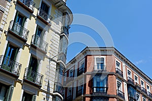 Urban classical buildings with windows and balconies downtown in Chueca district, centre of Madrid, Spain photo