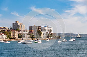 Urban coastline with waterfront property and yachts