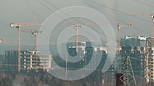 Urban construction of buildings time lapse. Urbanization - urban growth, tower cranes are working