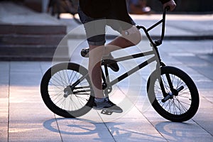 Urban cyclist in motion on the sidewalk