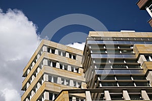 Urban, dense development with residential and commercial buildings.