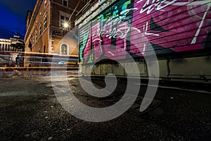Urban graffiti on the wall Piazza Venezia Rome at night
