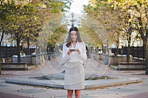 Urban happy business woman using tablet computer and working