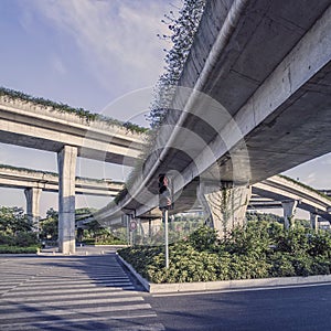 Urban highway overpass covered with plants and copy space for yo