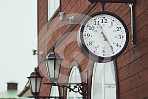 Urban historical architecture with vintage clock in street in London