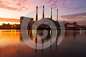 Urban infrastructure near the river at sunrise in New York.