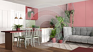 Urban jungle, kitchen and living room in white and red tones. Dining table, sofa and houseplants. Home garden interior design.