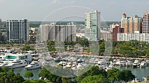 Urban landscape of downtown district of Sarasota in Florida, USA with luxury yachts in Sarasota Bay marina. Skyline with