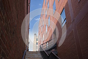 Urban landscape of stairs stacked between two commercial built structures