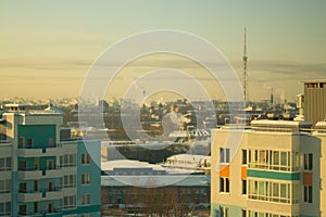 Urban landscape from the window. smoke from the chimneys