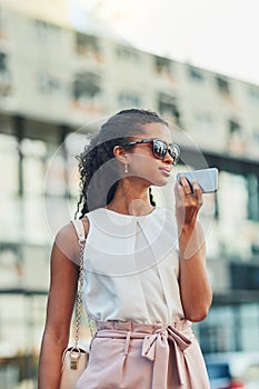 Urban living is using technology to get around. an attractive young woman on a call in the city.