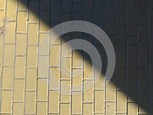 Urban modern yellow pavement tiles on the sunlight