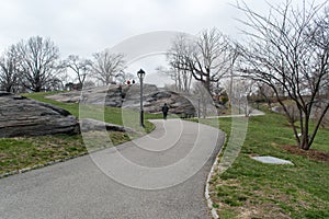 Urban park in early spring, middle of march, bare trees. New York