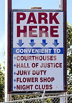 Urban PARK HERE sign: CONVENIENT TO COURTS