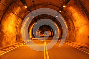 Urban photography: A road through an orange tunnel