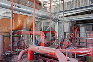 Urban power plant  interior. Multicolored industrial pipes  turbines