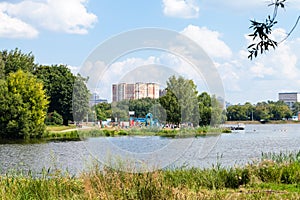 urban recreation area on lake on hot summer day photo