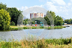 urban recreation area on pond on hot summer day photo